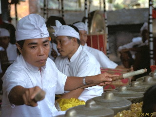 [Pic: Pak Mari on gamelan] 